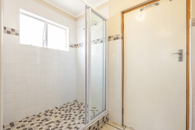 Single unit shower in bathroom